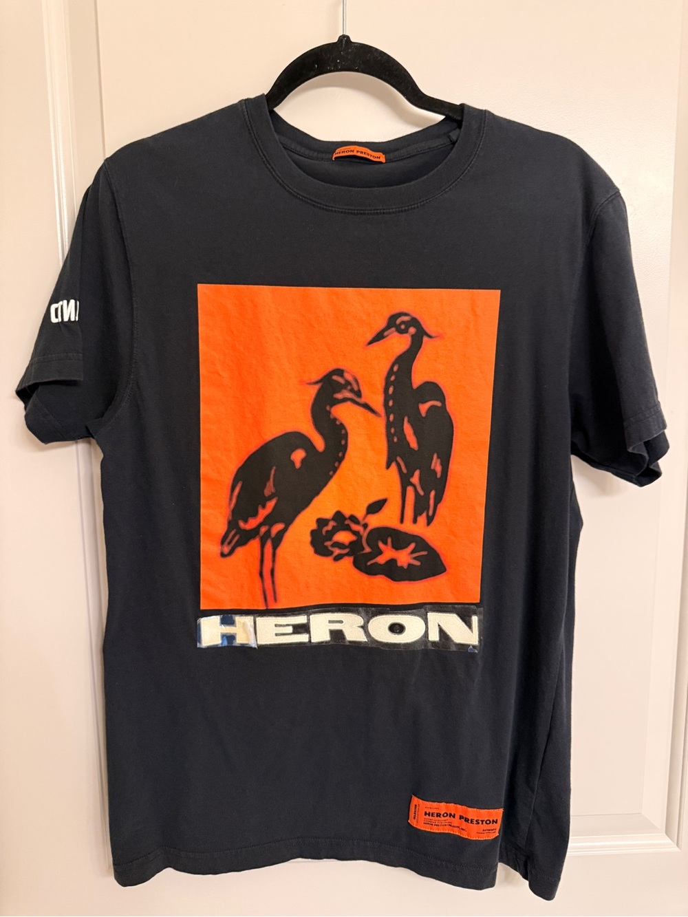 Heron Preston Black Tee with Bright Orange Heron Graphic